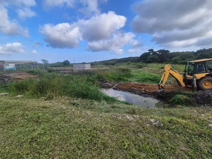 AB Sambane excavator clearing water infrastructure in Richards Bay